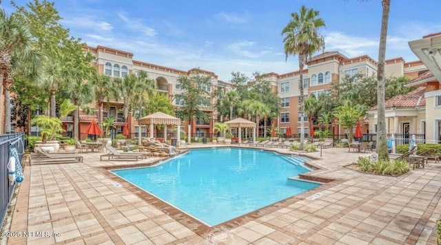 10435 Midtown Pkwy Unit 448, Jacksonville, FL 32246 - community pool with a patio and fence