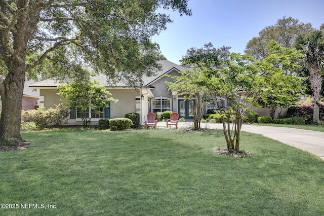 1317 Honeysuckle Dr, Saint Johns, FL 32259 - view of front of house with a front lawn and stucco siding