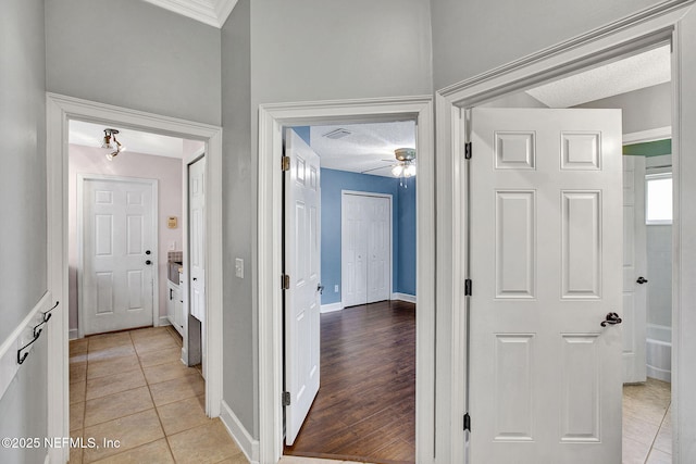 1317 Honeysuckle Dr, Saint Johns, FL 32259 - corridor featuring baseboards, a textured ceiling, and light tile patterned flooring