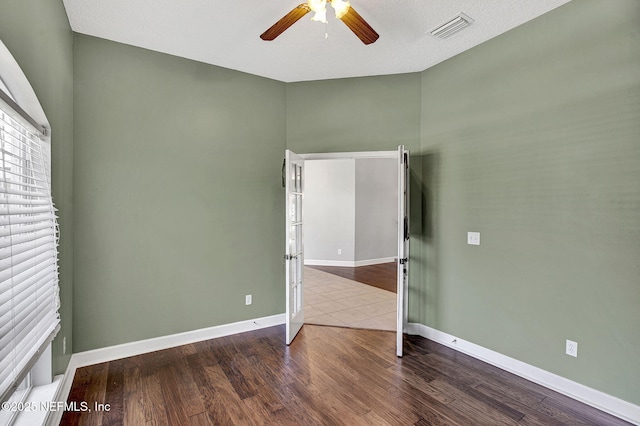 1317 Honeysuckle Dr, Saint Johns, FL 32259 - unfurnished room with visible vents, baseboards, a ceiling fan, and wood finished floors