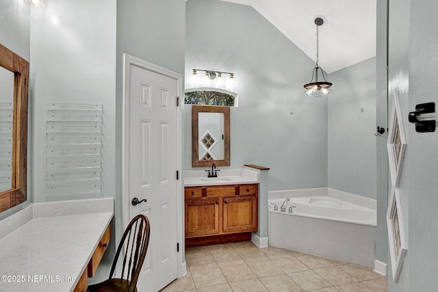 1317 Honeysuckle Dr, Saint Johns, FL 32259 - bathroom with tile patterned floors, a garden tub, vanity, and high vaulted ceiling