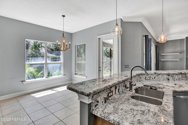 1317 Honeysuckle Dr, Saint Johns, FL 32259 - kitchen with light tile patterned floors, baseboards, a sink, and light stone counters