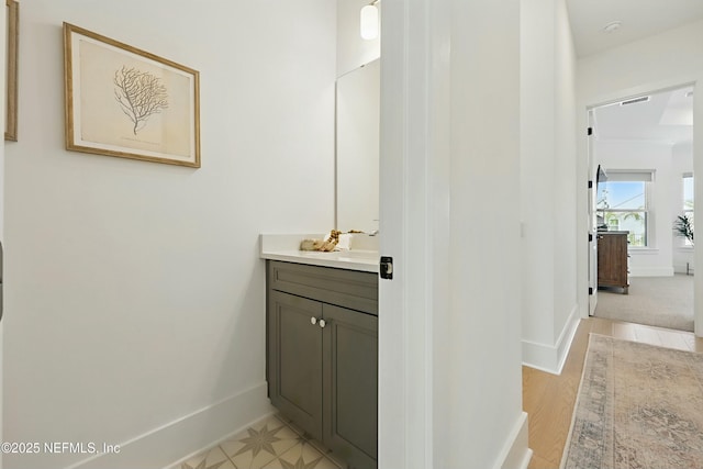 bathroom featuring vanity and baseboards