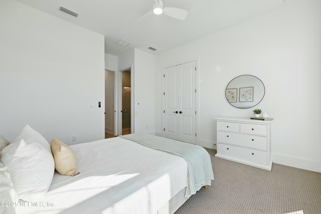 bedroom featuring a ceiling fan, carpet, visible vents, baseboards, and a closet