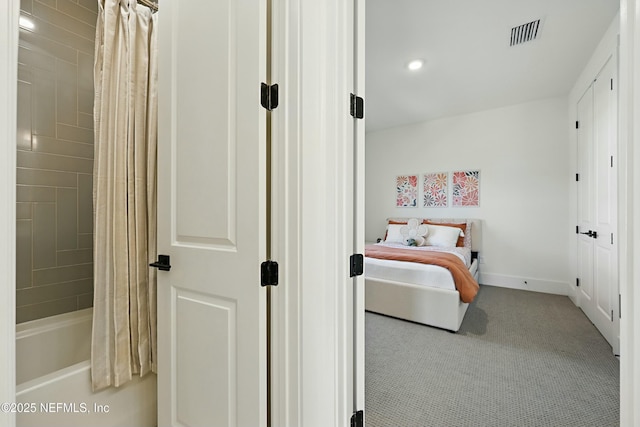 bedroom with visible vents, carpet flooring, and baseboards