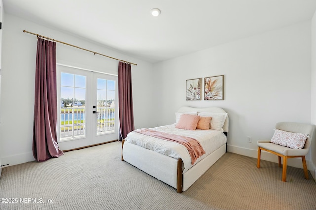 bedroom featuring access to exterior, carpet flooring, and baseboards