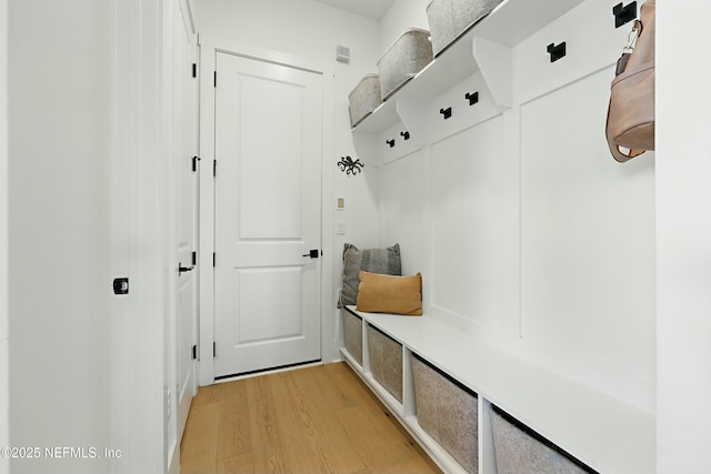 mudroom with light wood-style floors
