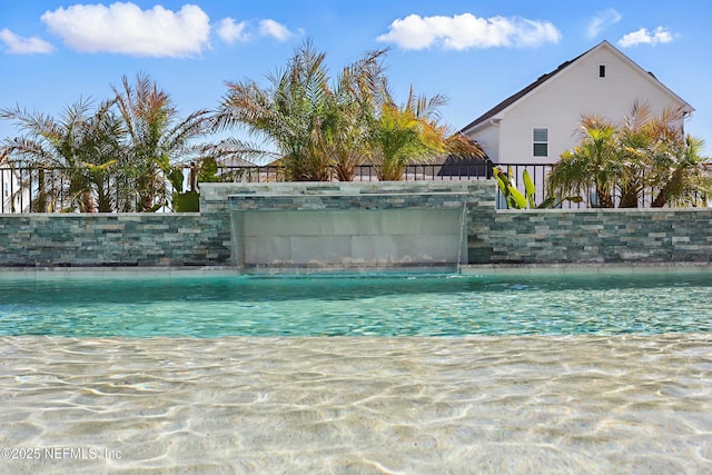 view of pool with fence