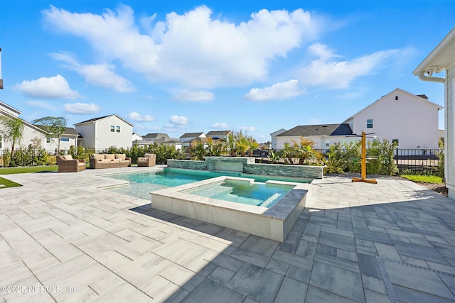 view of pool with fence, an in ground hot tub, a patio area, a residential view, and an outdoor hangout area