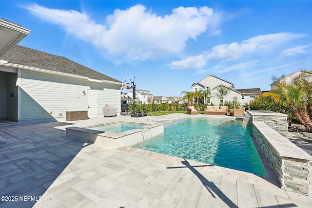 view of swimming pool with an outdoor living space, a patio, and a pool with connected hot tub