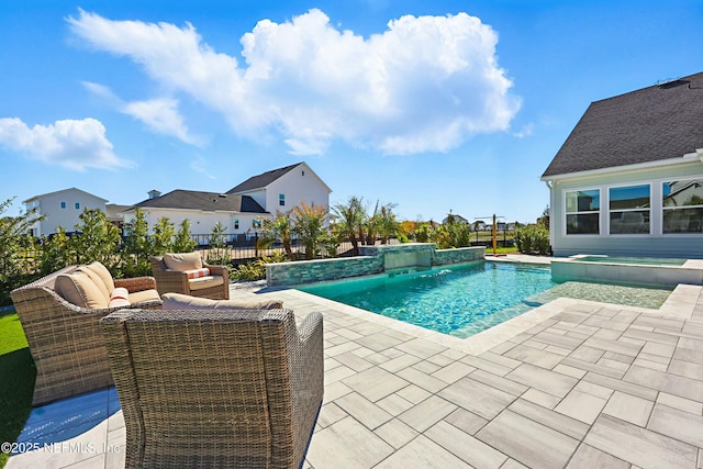 view of swimming pool featuring a patio area, an outdoor living space, a pool with connected hot tub, and fence