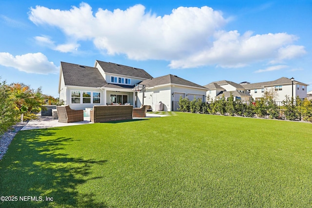 back of house with an outdoor living space, a lawn, and a patio area