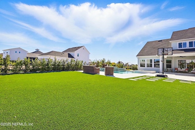 view of yard with a patio and an outdoor pool