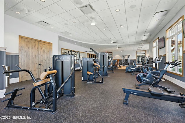 workout area with recessed lighting, visible vents, and a drop ceiling