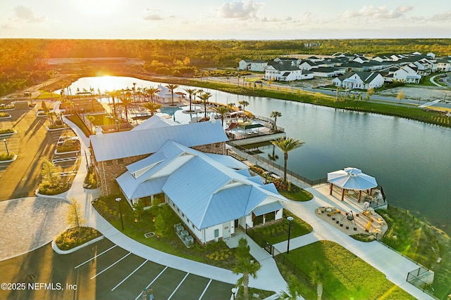 bird's eye view with a residential view and a water view