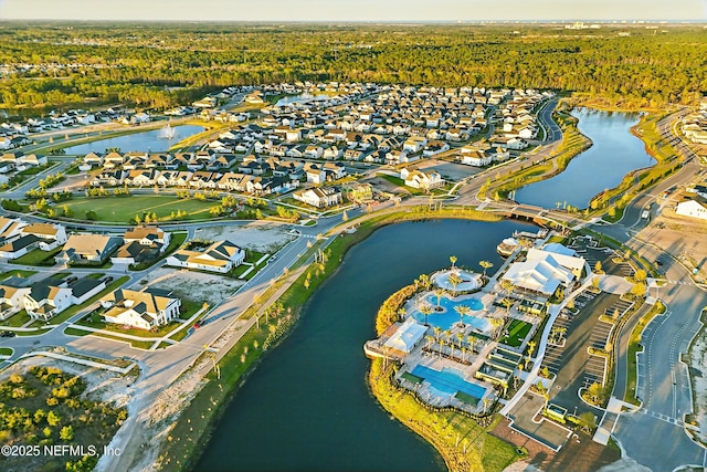 bird's eye view with a residential view and a water view
