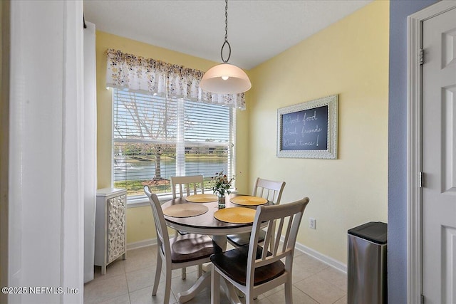 6738 White Blossom Cir Unit 36G, Jacksonville, FL 32258 - dining space featuring baseboards and light tile patterned floors