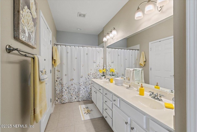 6738 White Blossom Cir Unit 36G, Jacksonville, FL 32258 - full bathroom with double vanity, a sink, tile patterned floors, and visible vents