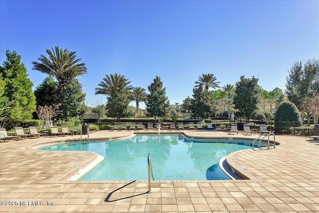 6738 White Blossom Cir Unit 36G, Jacksonville, FL 32258 - community pool with a patio and fence