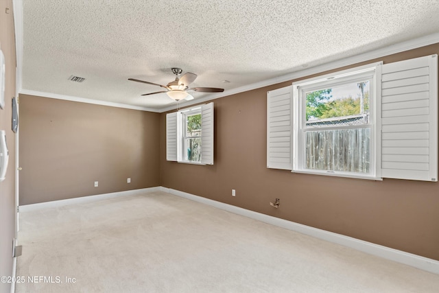 2795 Kiowa Ave, Orange Park, FL 32065 - carpeted empty room featuring a textured ceiling, visible vents, baseboards, ceiling fan, and ornamental molding