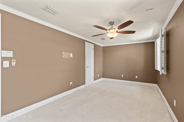 2795 Kiowa Ave, Orange Park, FL 32065 - unfurnished room with ornamental molding, baseboards, visible vents, a ceiling fan, and light carpet