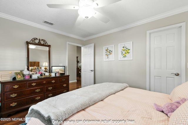 85 Fox Valley Dr, Orange Park, FL 32073 - bedroom with a textured ceiling, visible vents, crown molding, ceiling fan, and dark wood finished floors