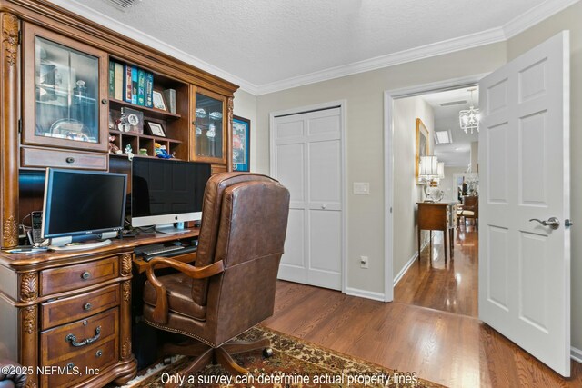 85 Fox Valley Dr, Orange Park, FL 32073 - office space with dark wood-style flooring, ornamental molding, baseboards, and a textured ceiling