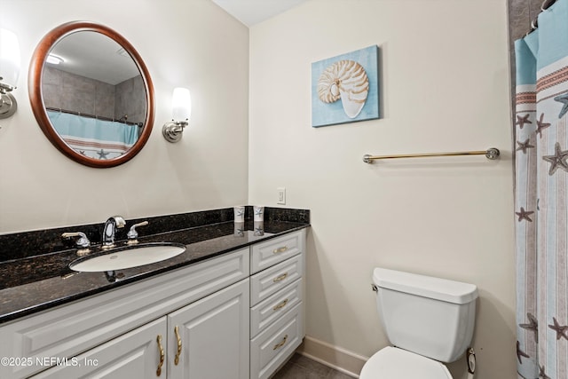 320 1st St Unit 806, Jacksonville Beach, FL 32250 - bathroom with tile patterned floors, baseboards, toilet, and vanity