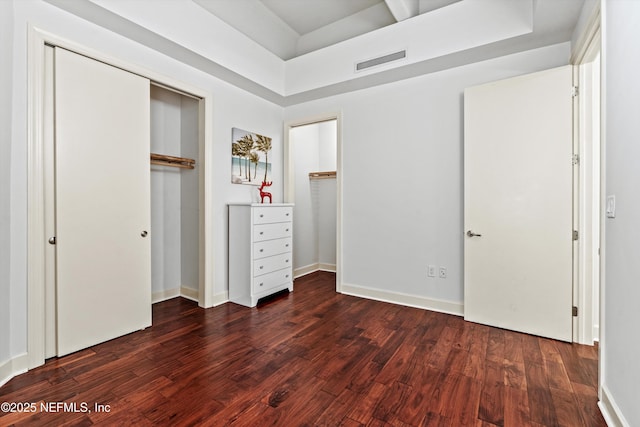 320 1st St Unit 806, Jacksonville Beach, FL 32250 - unfurnished bedroom featuring visible vents, baseboards, and dark wood-type flooring