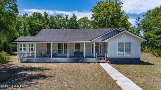 5398 Laurie Ln, Middleburg, FL 32068 - view of front facade featuring a porch, crawl space, a front lawn, and a shingled roof