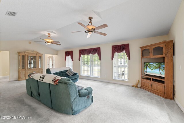 5398 Laurie Ln, Middleburg, FL 32068 - living area with light carpet, a ceiling fan, vaulted ceiling, and baseboards