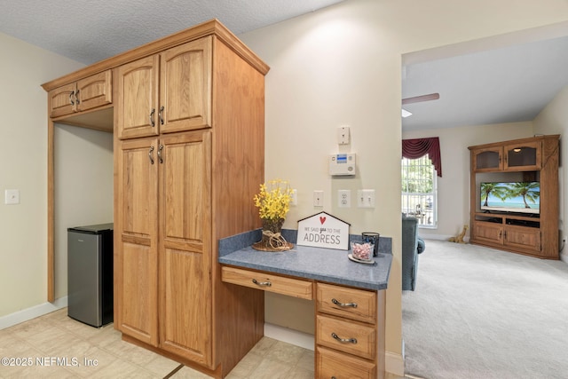 5398 Laurie Ln, Middleburg, FL 32068 - kitchen with freestanding refrigerator, dark countertops, and baseboards