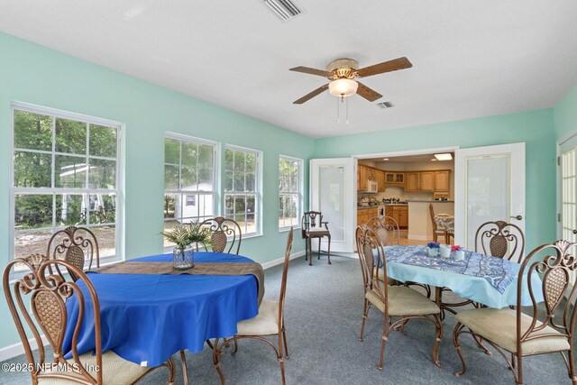 5398 Laurie Ln, Middleburg, FL 32068 - dining space with ceiling fan, baseboards, and carpet flooring