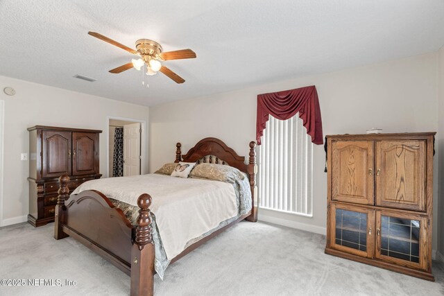 5398 Laurie Ln, Middleburg, FL 32068 - bedroom featuring light carpet, baseboards, and ceiling fan