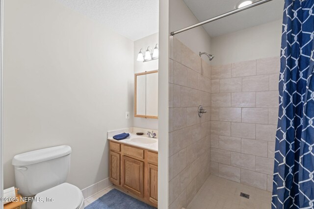 5398 Laurie Ln, Middleburg, FL 32068 - full bathroom featuring tiled shower, toilet, vanity, and tile patterned flooring