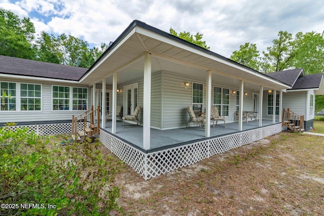 5398 Laurie Ln, Middleburg, FL 32068 - back of property featuring roof with shingles and covered porch