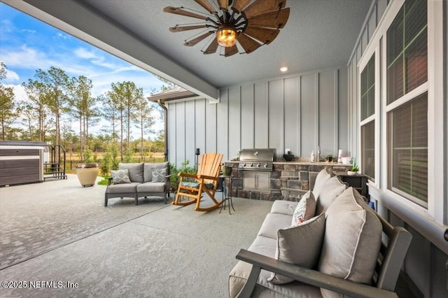 view of patio / terrace featuring an outdoor living space, grilling area, and a ceiling fan