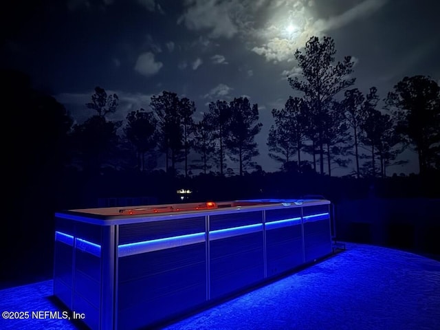 view of pool at night