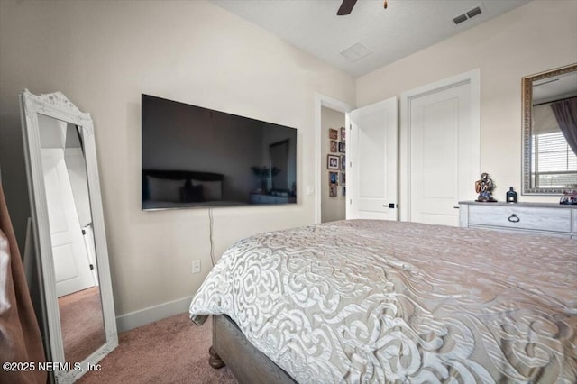 bedroom featuring visible vents, carpet floors, baseboards, and a ceiling fan