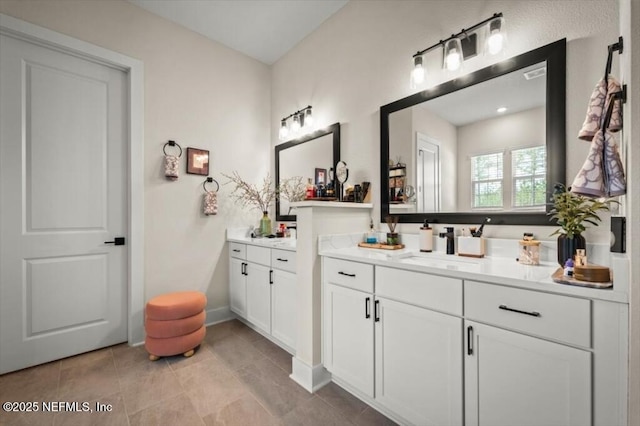 bathroom featuring vanity and tile patterned floors