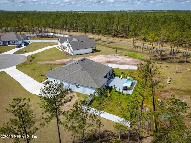 drone / aerial view with a view of trees