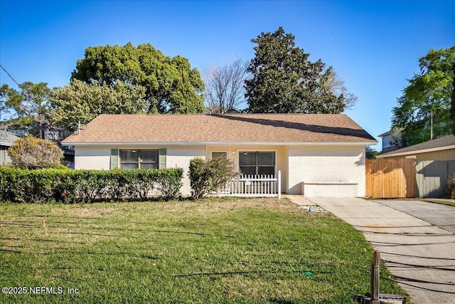 14319 Cedar Island Rd N, Jacksonville, FL 32250 - ranch-style home with a front yard and fence