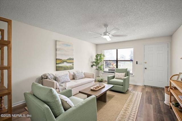 14319 Cedar Island Rd N, Jacksonville, FL 32250 - living area featuring dark wood-type flooring, baseboards, a textured ceiling, and ceiling fan