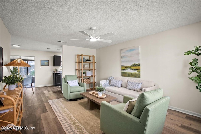 14319 Cedar Island Rd N, Jacksonville, FL 32250 - living area featuring visible vents, baseboards, ceiling fan, and dark wood finished floors
