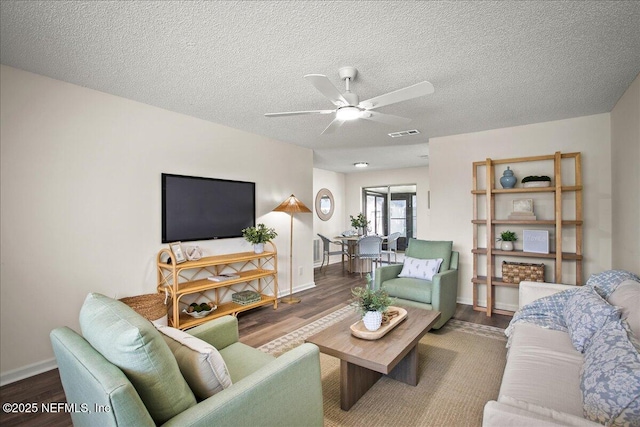 14319 Cedar Island Rd N, Jacksonville, FL 32250 - living area with a ceiling fan, visible vents, a textured ceiling, and wood finished floors
