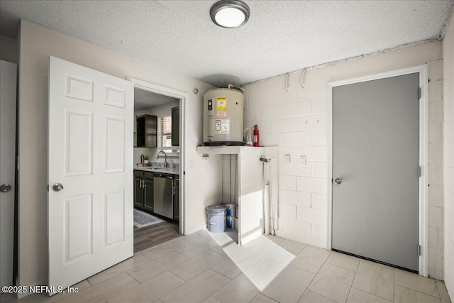 14319 Cedar Island Rd N, Jacksonville, FL 32250 - interior space featuring dishwasher, water heater, concrete block wall, and a textured ceiling