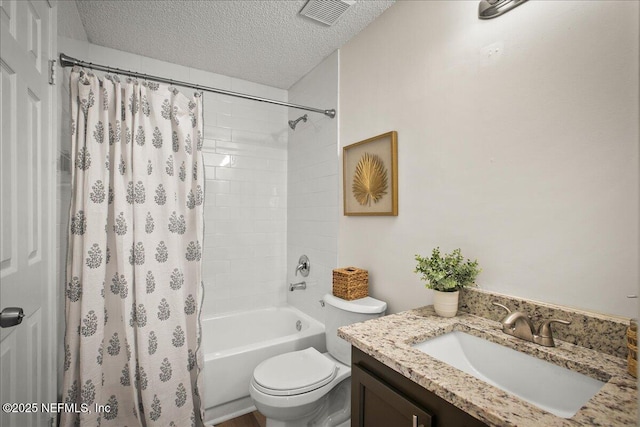 14319 Cedar Island Rd N, Jacksonville, FL 32250 - full bathroom with a textured ceiling, visible vents, toilet, vanity, and shower / bath combo with shower curtain