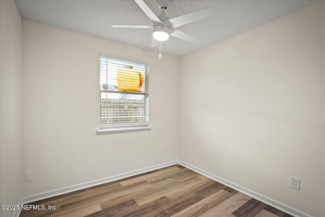 14319 Cedar Island Rd N, Jacksonville, FL 32250 - spare room featuring a ceiling fan, a textured ceiling, baseboards, and wood finished floors