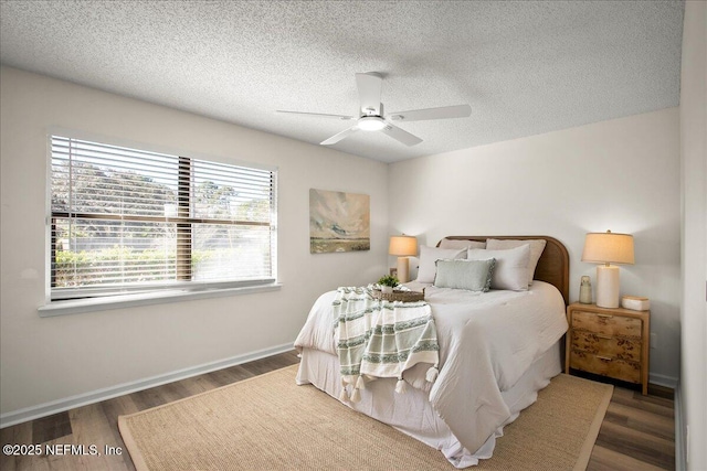 14319 Cedar Island Rd N, Jacksonville, FL 32250 - bedroom featuring baseboards, a textured ceiling, wood finished floors, and a ceiling fan