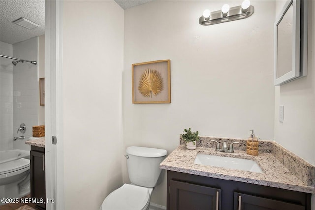 14319 Cedar Island Rd N, Jacksonville, FL 32250 - full bath with shower / washtub combination, toilet, vanity, and a textured ceiling